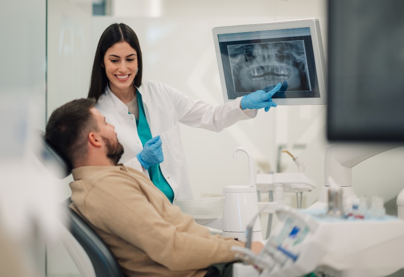 Dentist and patient discussing chipped tooth treatment options during a consultation in Fremont, IN