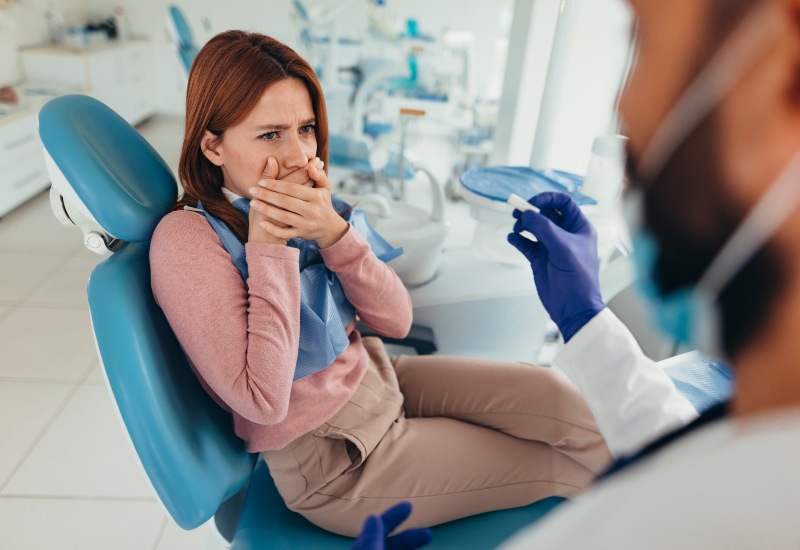 Patient experiencing dental anxiety during a dental appointment in Fremont, IN